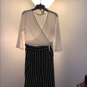 white , black and gold jumpsuit